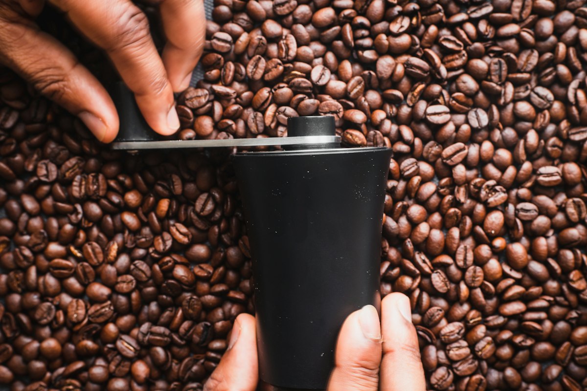 Compact travel coffee bean container